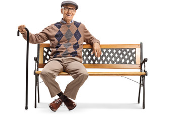 Wall Mural - Happy senior gentleman sitting on a bench