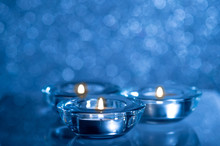 Christmas Composition Of Candles On A Blue Background