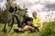 © Westend61 - mature, man using digital tablet during his bike tour with an e-bike