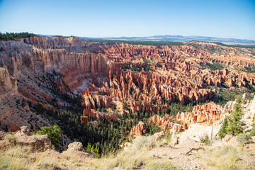 The spectacle of thousands of glowing orange earthen spires concentrated in the valley below the rim of Bryce Canyon National Park is an amazing site