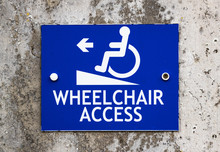 Wheelchair Access sign on concrete wall background