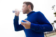 © Westend61 - Portrait of jogger, drinking from water bottle