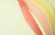 © Westend61 - Close-up of colorful quilling papers on beige background