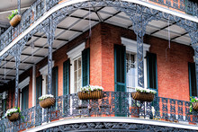 New Orleans, USA Old Town Street In Louisiana Famous City With Closeup Of Typical Cast Iron Balcony Wall Corner Building