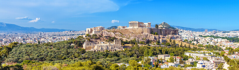 Wall Mural - Panorama of Athens with Acropolis hill, Greece. Famous old Acropolis is a top landmark of Athens. Landscape of the Athens city with classical Greek ruins. Scenic view of remains of ancient Athens.