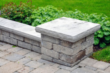 A Seat Wall With Pillars And Natural Stone Coping Helps Define A Tumbled Paver Driveway And Is A Beautiful Landscaping Feature.