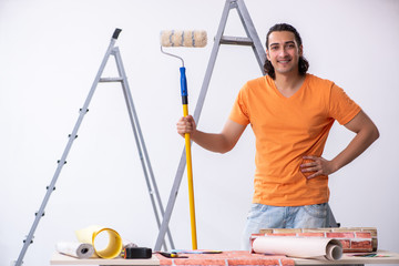 Young man contractor doing renovation at home