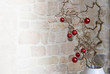 © stock mp - Branch with beautiful christmas tree balls in front of stone wall in loft