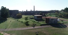 Aerial Drone Scene Of Abandoned Industrial Construction. Volume Light. Ascending To General View Of Rusty Architecture, The Anglo, Fray Bentos, Unesco, Uruguay