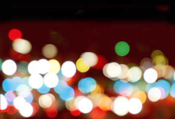 Wall Mural - Abstract colorful bokeh and blurred reflection lighting on black background