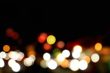 Wall Mural - Abstract colorful bokeh and blurred reflection lighting on black background