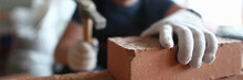Professional Bricklayer Working On Construction