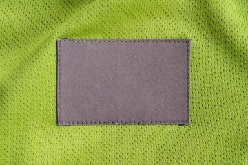 laundry care clothing label patch on polyester fabric jersey sport texture