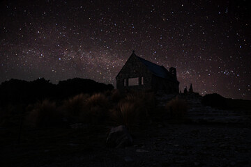 Wall Mural - milky way galaxy over the sky at the old house in the countryside at night