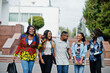 © AS Photo Family - Group of five african college students spending time together on campus at university yard. Black afro friends studying. Education theme.