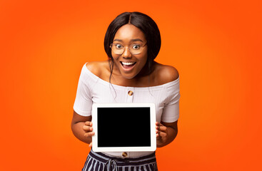 Excited African American Woman Showing Tablet Screen, Mockup, Studio Shot
