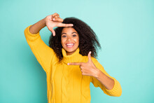 Photo Of Amazing Dark Skin Lady Making Imaginary Frame Cadre Of Camera Taking Shot Wear Yellow Knitted Pullover Isolated Blue Teal Color Background