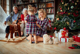 Fototapeta Panele - generation people playing together with little girl on Christmas