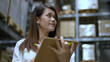 © S photographer - Business concepts. The girl is checking the balance of goods in the stock room. 4k Resolution.