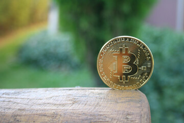 Bitcoin gold coin on wooden table with blur background, Bitcoin coin business concept