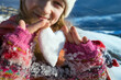 girl holds in her hands a heart of snow
