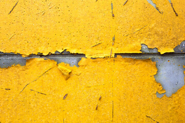 Wall Mural - concrete wall with yellow, orange peeling paint old cracked damaged rough bright background texture