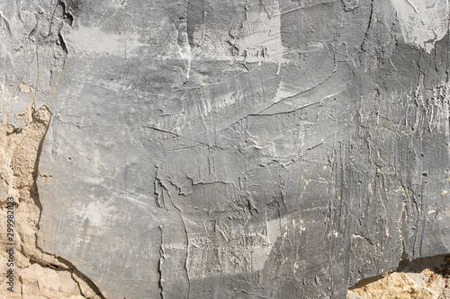 Fotografía The texture of gypsum or alibaster cracked plaster on the wall is a thick layer