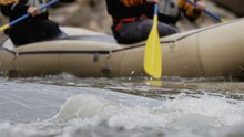 Whitewater Rafters Paddling Down Rapids In River Slow Motion