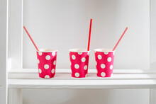 The Pink Polka Dot Paper Cups On White Shelf In The Kitchen Cabinet