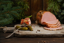 Holiday Delicious Spiced Roasted Ham For Christmas Dinner With Pickled Cucumber And Pickled Mushrooms On Wooden Cutting Board. Winter Decoration, Menu Or Cook Book Concept. Horizontal