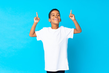 Poster - African American boy over isolated blue background pointing up a great idea