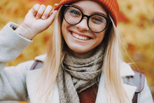 Young Woman In Hat Is Smiling Wide