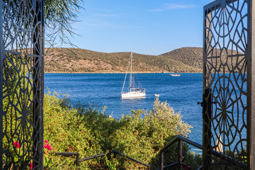 Beautiful Mediterranean coast with islands, mountains and yachts in the blue sea