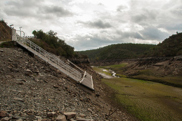 Wall Mural - The Ponsul River is a affluent of the Tejo River, in Portugal, and is a very large river. At this time it is completely dry, without water and with its bed cracked due to climate change