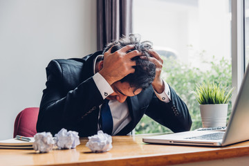 Asian young business man tired strain failure on he work