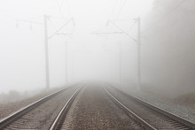 Rails On The Railway, Leaving Into The Foggy Distance Beyond The Horizon.