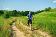 © Dmitry Bairachnyi - Man runner running on the rural road