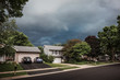 Thunderstorm clouds over a suburban neighborhood