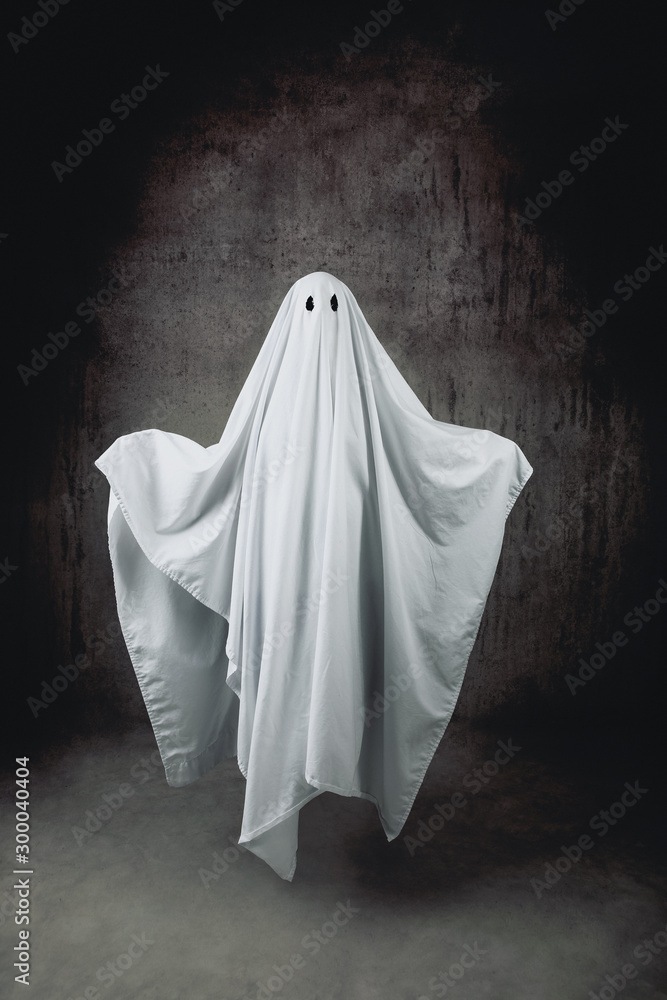 Ghost in a sheet floating in the air - obrazy, fototapety, plakaty 