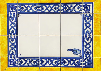 plaque of yellow and blue portuguese tiles