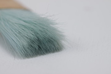  Close up picture of a brush with blue hairs