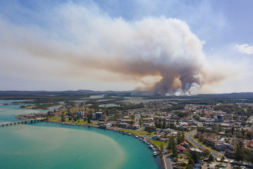 Wall Mural - the town of Tuncurry on the new south wales north coast drone with bush fire out of control in bushland.