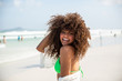 © Nexa - Black afro young cute girl, curly hair, bikini, beach. Afro American summer vacation holiday.