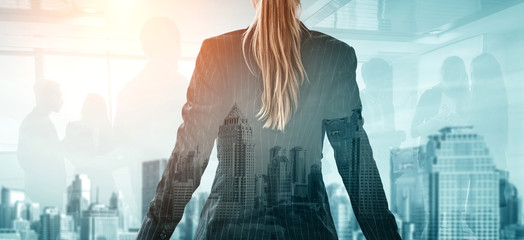 Wall Mural - Double Exposure Image of Business Person on modern city background. Future business and communication technology concept. Surreal futuristic cityscape and abstract multiple exposure graphic interface.