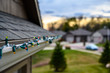 © Lost_in_the_Midwest - Hanging Christmas lights on gutter edge with plastic clips