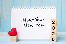 New Year New You Words And 2020 Cubes With Red Heart Shape Decoration On Blue Wooden Table Background. Goal, Resolution, Health, Love And Happy Valentine’s Day Concept
