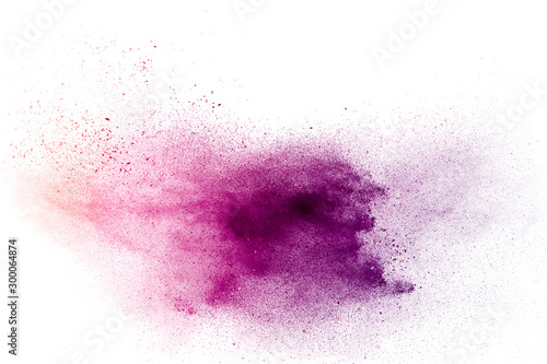 Purple particles explosion on white background. Freeze motion of purple dust ...