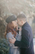 © pavelvozmischev - The first snow and bright emotions of people. Couple's walk in autumn Park.