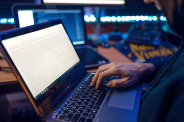 Hacker in hood shows thumbs up, network criminal