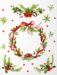 Poster - Christmas composition  with red ribbon, branches of spruce and holly with red berries in shape of Christmas bauble on white background. Merry christmas greeting card with empty space for holiday text.